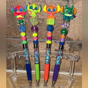 SET OF FOUR STITCH GLOW BLACKLIGHT CHARACTER PENS. DISNEY